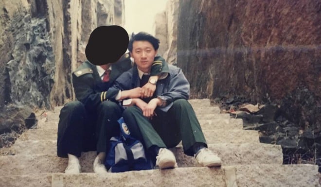 Ma Baoli sits with his boyfriend in the early 1990s when he was a young police cadet in China’s northern Qinghuangdao city.