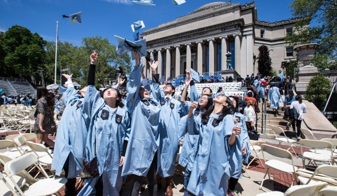 A group of Chinese graduates celebrate after commencement at Columbia University in 2016.