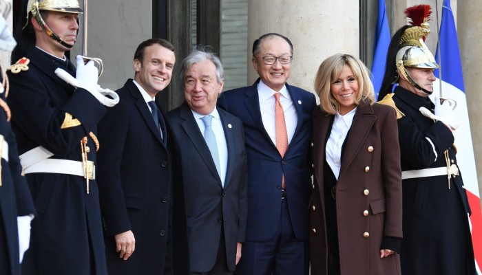 French President Emmanuel Macron with his wife Brigitte Macron and United Nations Secretary General Antonio Guterres and World Bank President Jim Yong Kim. Photo: AFP