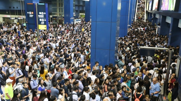 After one of the most powerful storms on record to hit the city, suspensions and delays mean confusion and long waits for residents