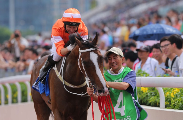 Neil Callan shows Blazing Speed some affection after winning the Group One Champions & Chater Cup. Photos: Kenneth Chan