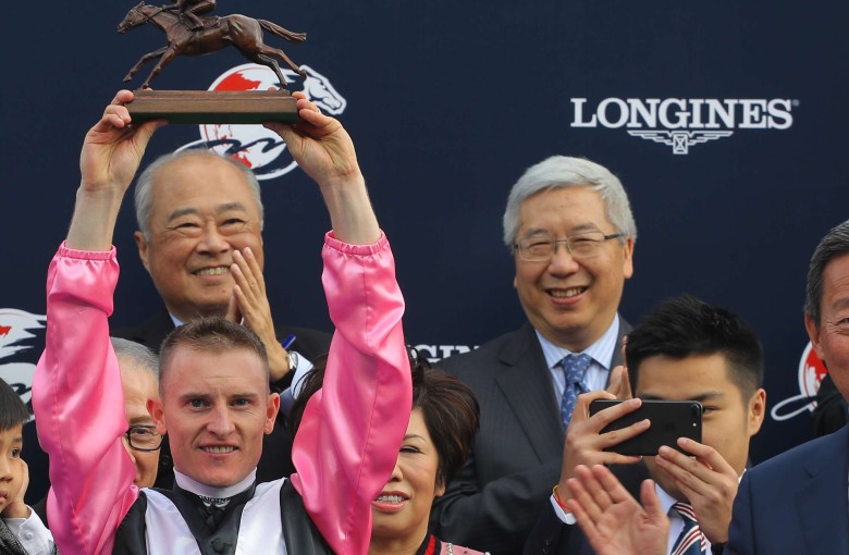 Zac Purton celebrates winning the Hong Kong Mile with Beauty Only. Photo: Kenneth Chan