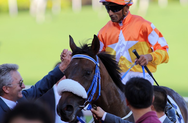 Karis Teetan shakes hands with trainer David Ferraris after completing a treble aboard Amazing Agility. Photos: Kenneth Chan