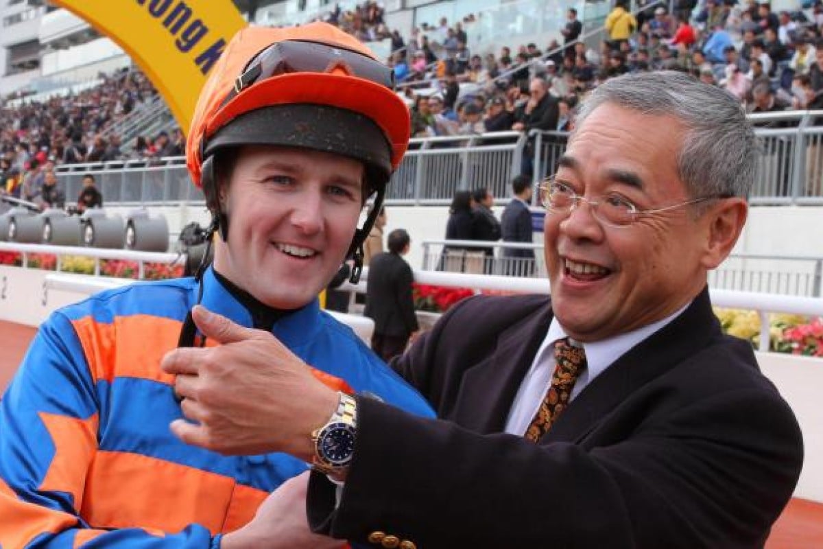 Tom Queally enjoys his moment with trainer Peter Ng.
