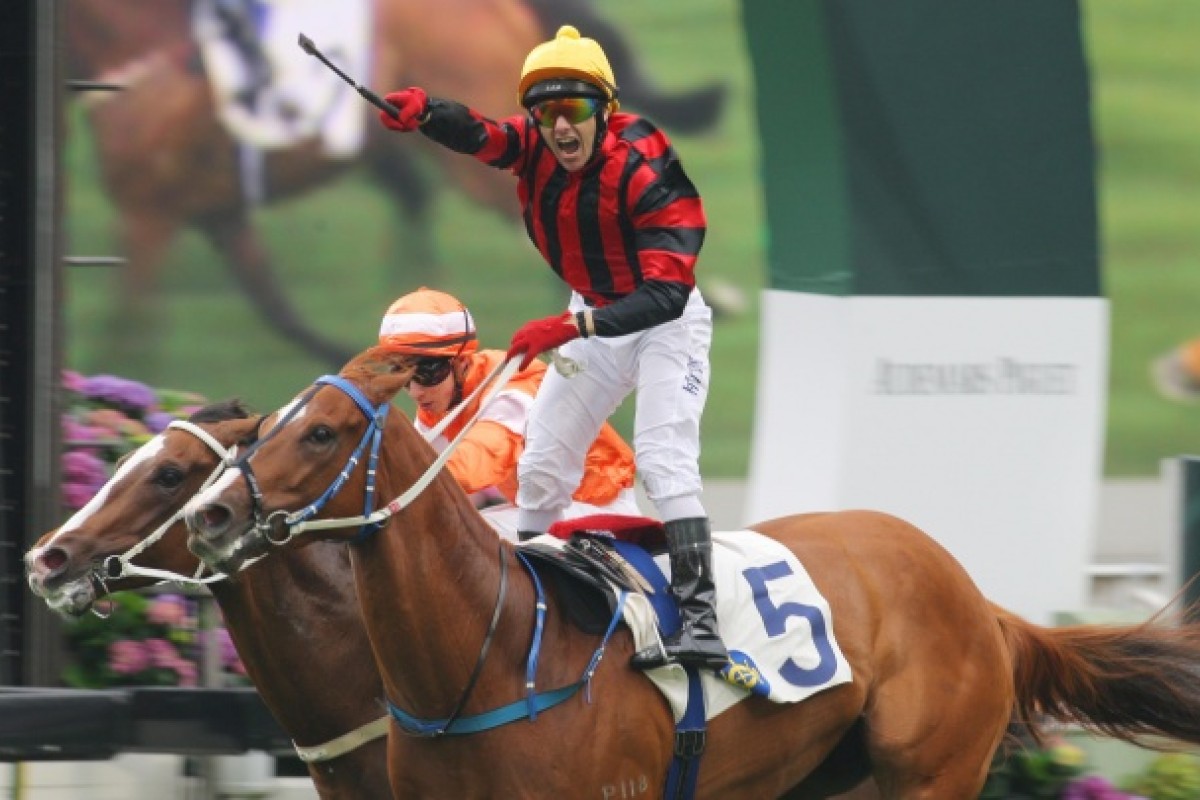 Brett Prebble stands in his stirrups in delight after Rainbow Chic's triumph. Photo: Kenneth Chan