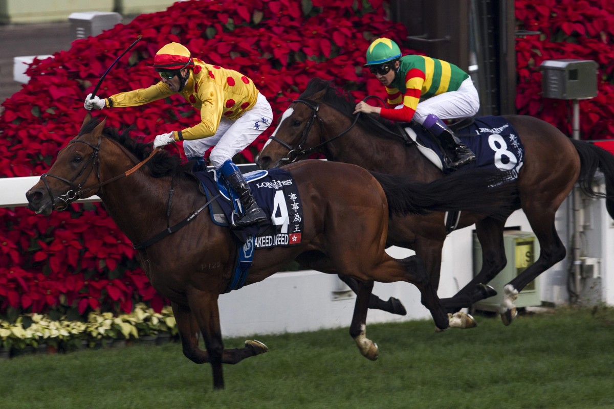 Douglas Whyte wins the HK$22 million Longines Hong Kong Cup with Akeed Mofeed at Sha Tin on Sunday. Photos: Reuters