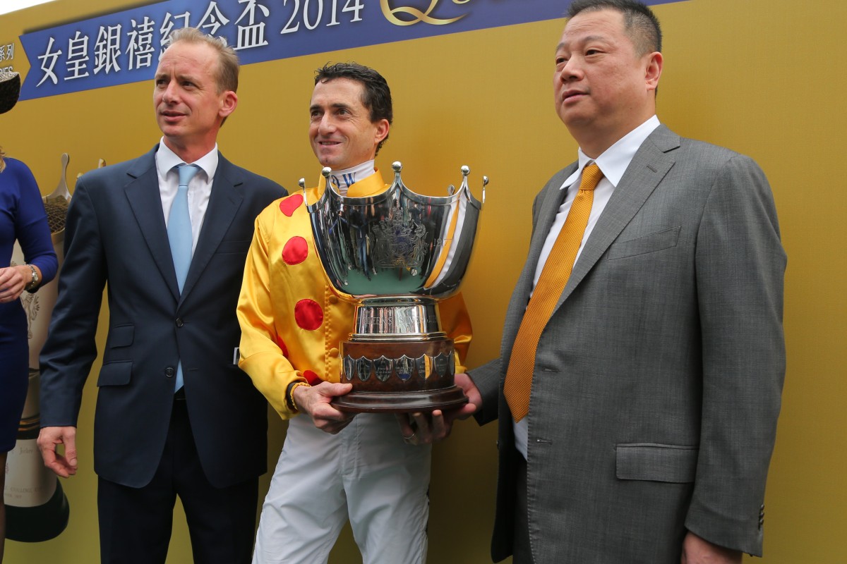 Trainer Richard Gibson, jockey Douglas Whyte and owner Pan Sutong celebrate Gold-Fun's success.