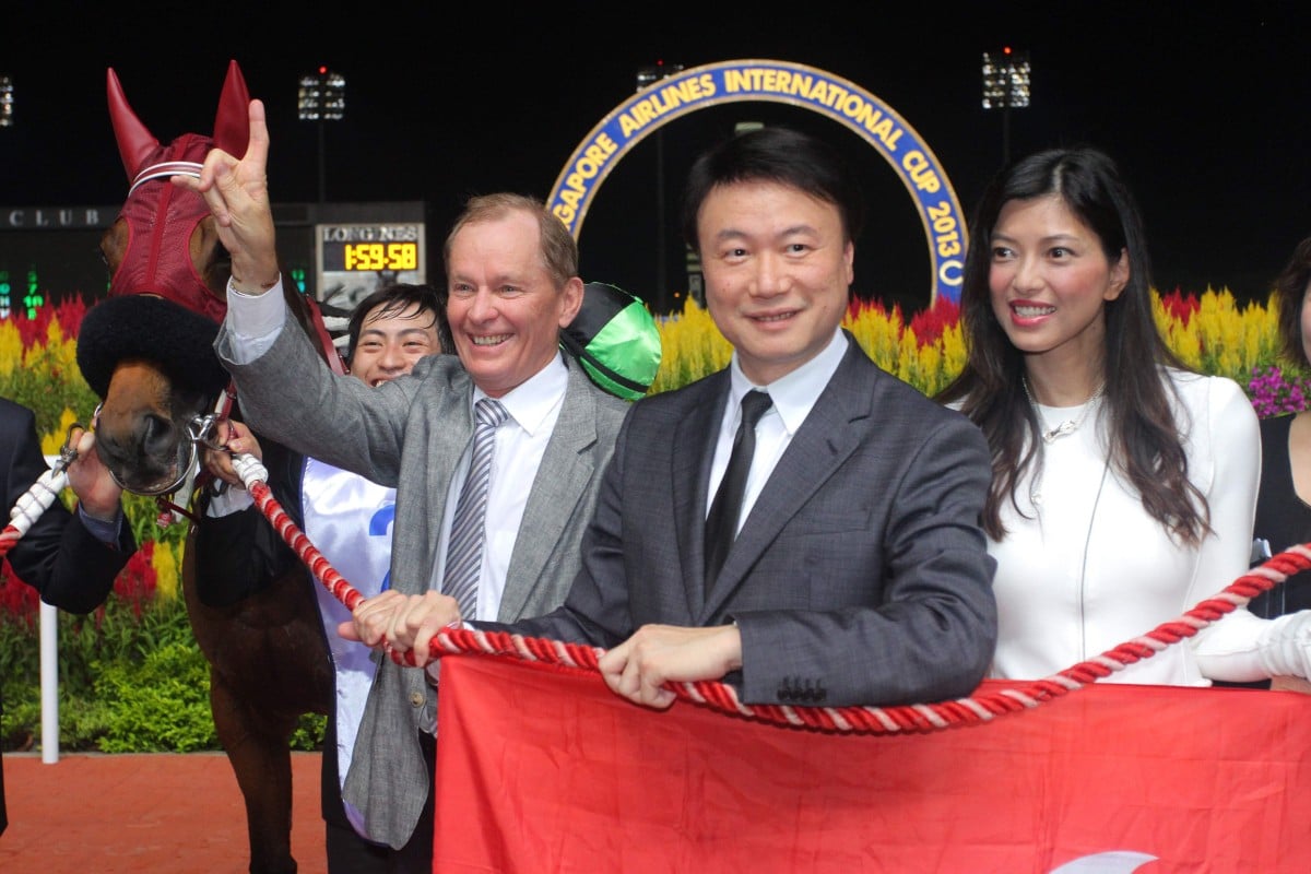 Steven Lo and his wife, pictured with trainer John Moore and Military Attack. Photo: Kenneth Chan