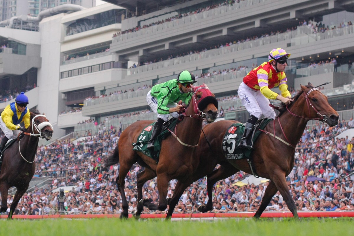 Designs On Rome (Tommy Berry) gets the better of Military Attack (Joao Moreira) to make it a Moore 1-2 in front of an excitable Sha Tin crowd yesterday. Photo: Kenneth Chan