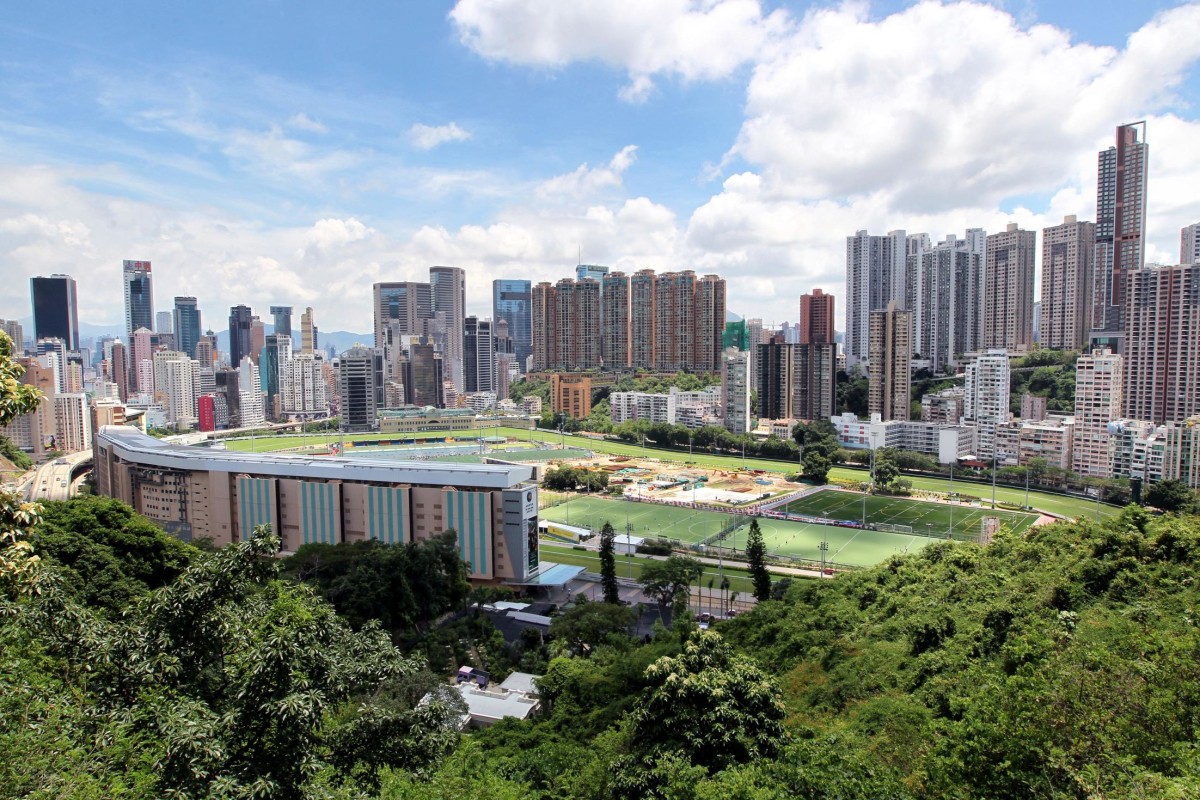Happy Valley Racecourse by day, surrounded by skyscrapers and residential buildings. Photo: SCMP Pictures