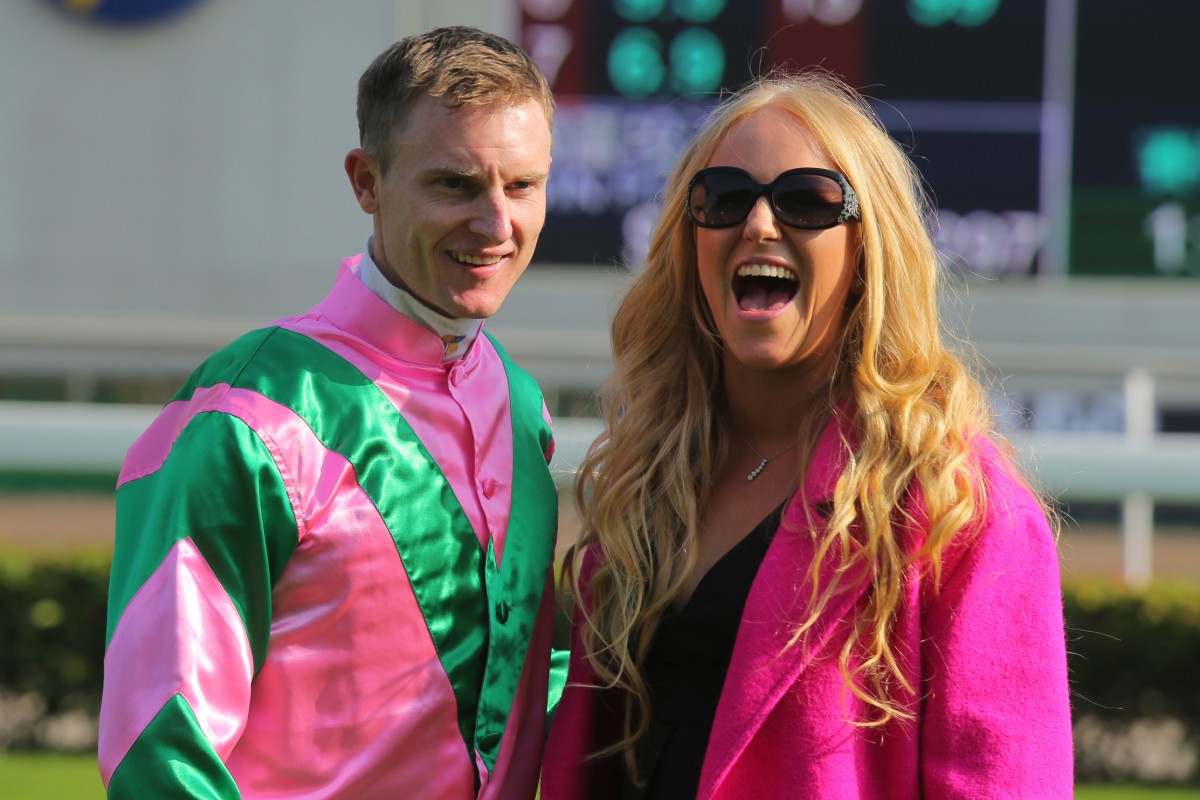 Zac Purton celebrates his Hong Kong Sprint win with wife Nicole. Photo: Kenneth Chan