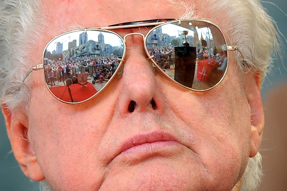 The Melbourne Cup is reflected in the sunglasses of Bart Cummings in this 2009 picture. Photo: AFP