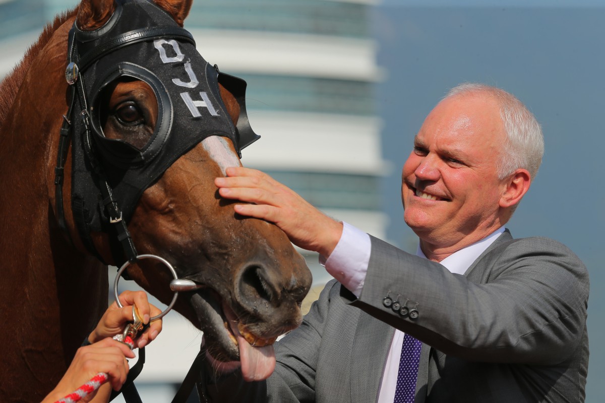 David Hall shows his affection for eight-year-old Bamboo Dance, who has gone to new heights since returning to his stable earlier this year. Photo: Kenneth Chan