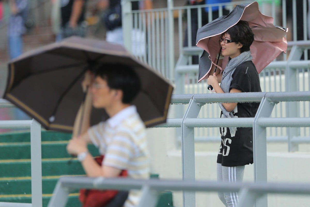 A wet and windy day, brought on by Typhoon Mujigae, caused attendance to plummet and turnover to drop on a day already affected by the absence of star jockeys Joao Moreira and Zac Purton. Photo: Kenneth Chan