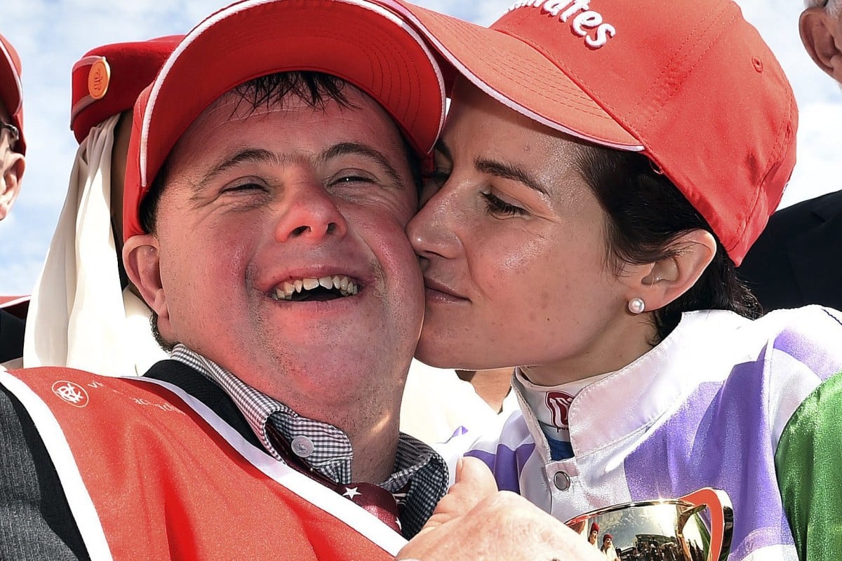 Jockey Michelle Payne celebrates with stable hand brother Stevie after winning the Melbourne Cup aboard Prince of Penzance. Photo: EPA