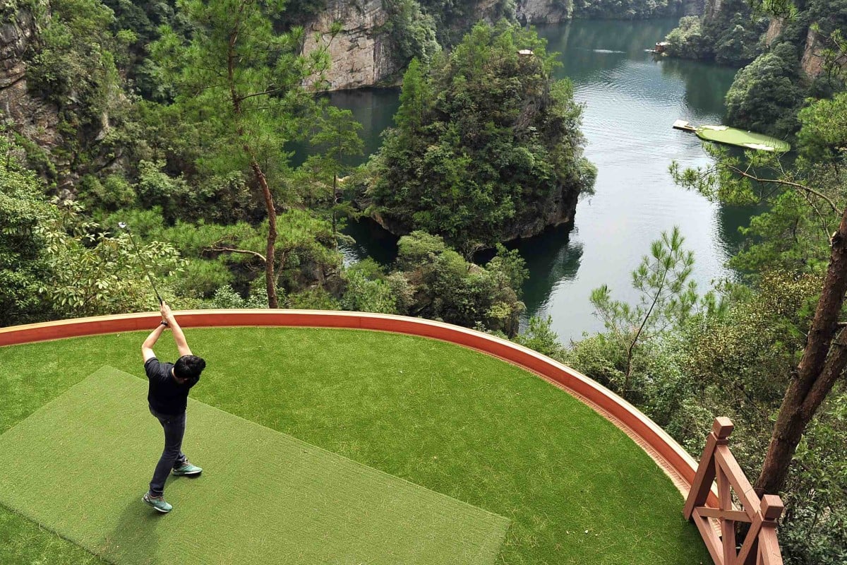 Novelty golf promotions in China, like this shoot-out into a lake in Hangjiajie, Hunan province, are unlikely to be seen again after President Xi Jinping's crackdown. Photo: Reuters