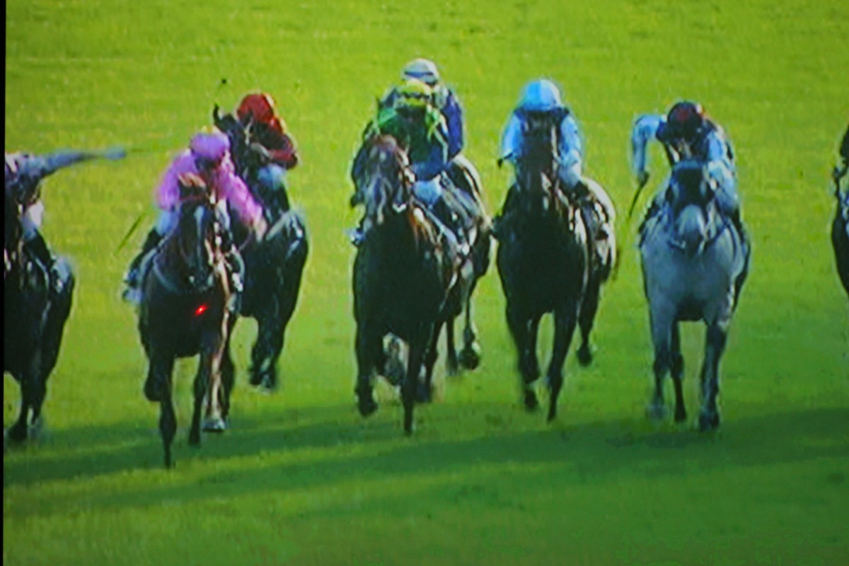 A freeze-frame sequence of Joao Moreira losing his whip from his right hand, before catching it in his left. Click right to view the sequence. Photo: Kenneth Chan