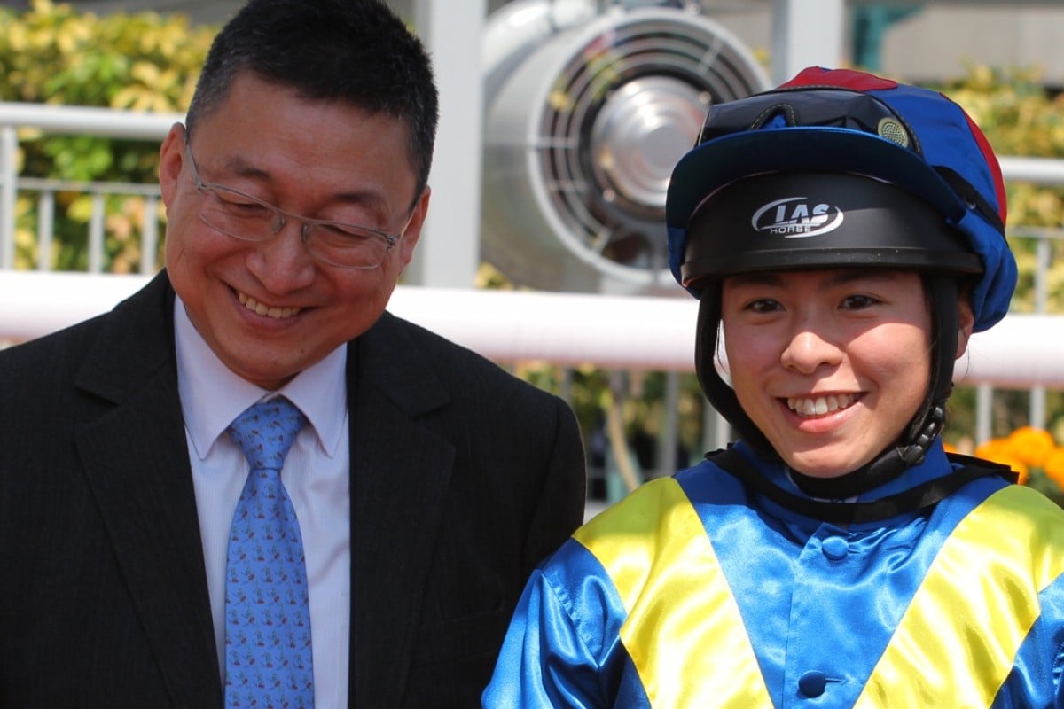 Kei Chiong celebrates with her master Francis Lui after the apprentice scored her first win since returning from injury on Helen’s Choice. Photo: Kenneth Chan
