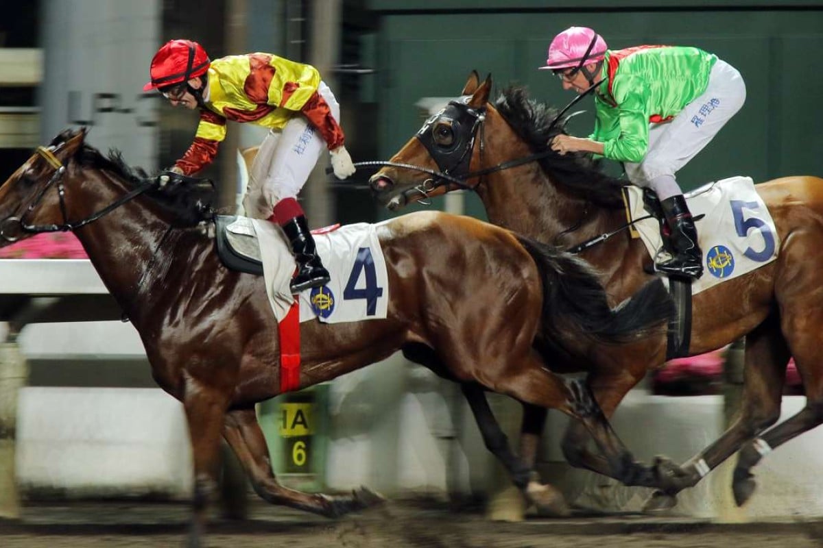 French jockey Olivier Doleuze stands up in the stirrups as he passes the winning post aboard Our Folks in the final race of the night at Sha Tin. Photos: Kenneth Chan