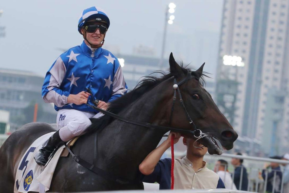 Zac Purton was all smiles after winning on promising Washington Heights in the last race. Photo: Kenneth Chan
