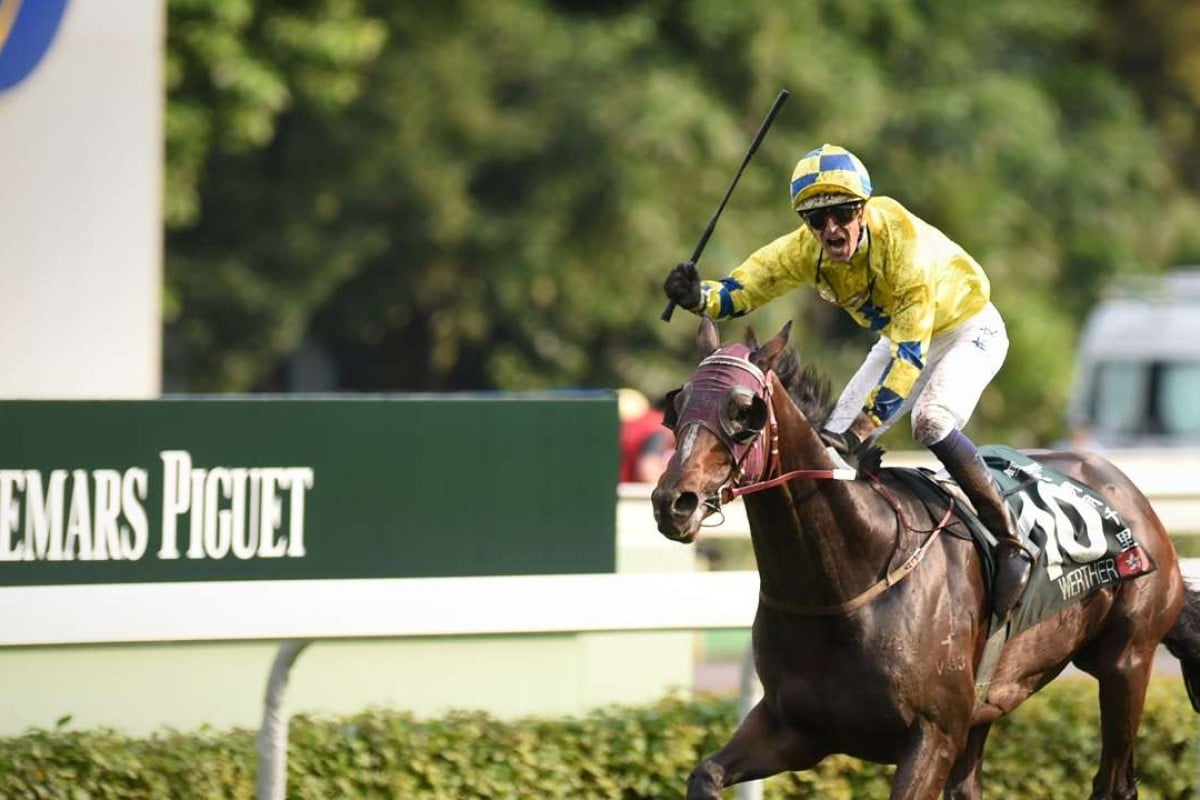 Hugh Bowman celebrates as Werther storms home at Sha Tin in the Audemars Piguet QEII Cup. Photo: AFP