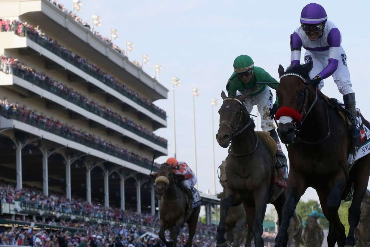 Mario Gutierrez celebrates atop Nyquist after crossing the finish line to win the Kentucky Derby. Photo: AFP