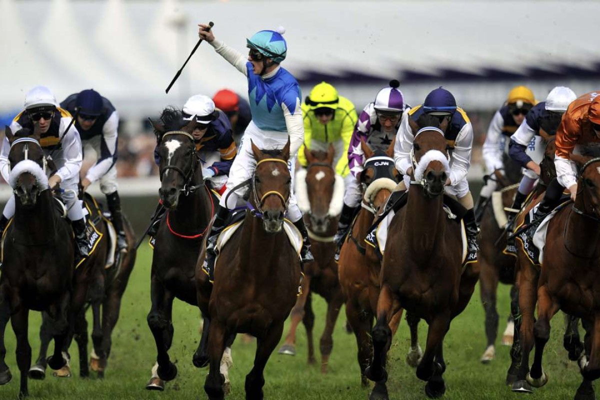 Zac Purton celebrates winning the Caulfield Cup on Japanese horse Admire Rakti in 2014. Photo: EPA/JULIAN SMITH