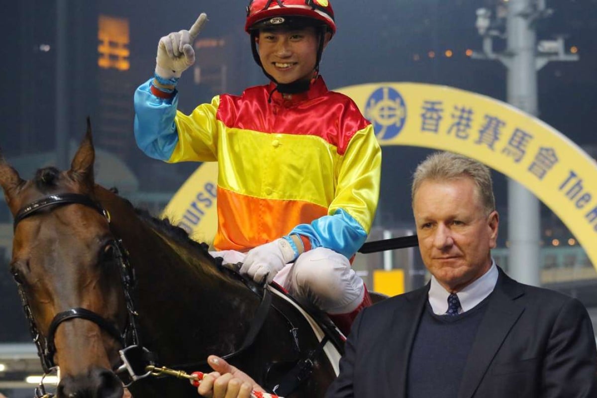 Dylan Mo and Tony Millard pose for the cameras after Travel Comforts’ win at Happy Valley on Wednesday night. Photos: Kenneth Chan