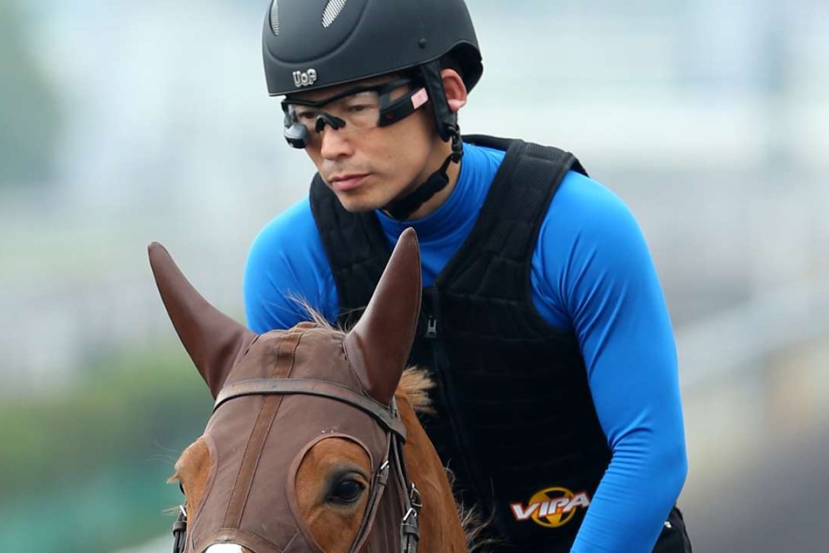 Work rider Shinjiro Kaneko wears his goggle technology giving him real-time information on Neorealism as he works at Sha Tin. Photos: Kenneth Chan