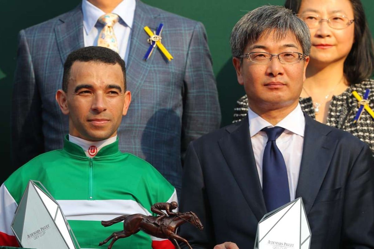 Joao Moreira and Noriyuki Hori collect their QE II Cup trophies. Photos: Kenneth Chan