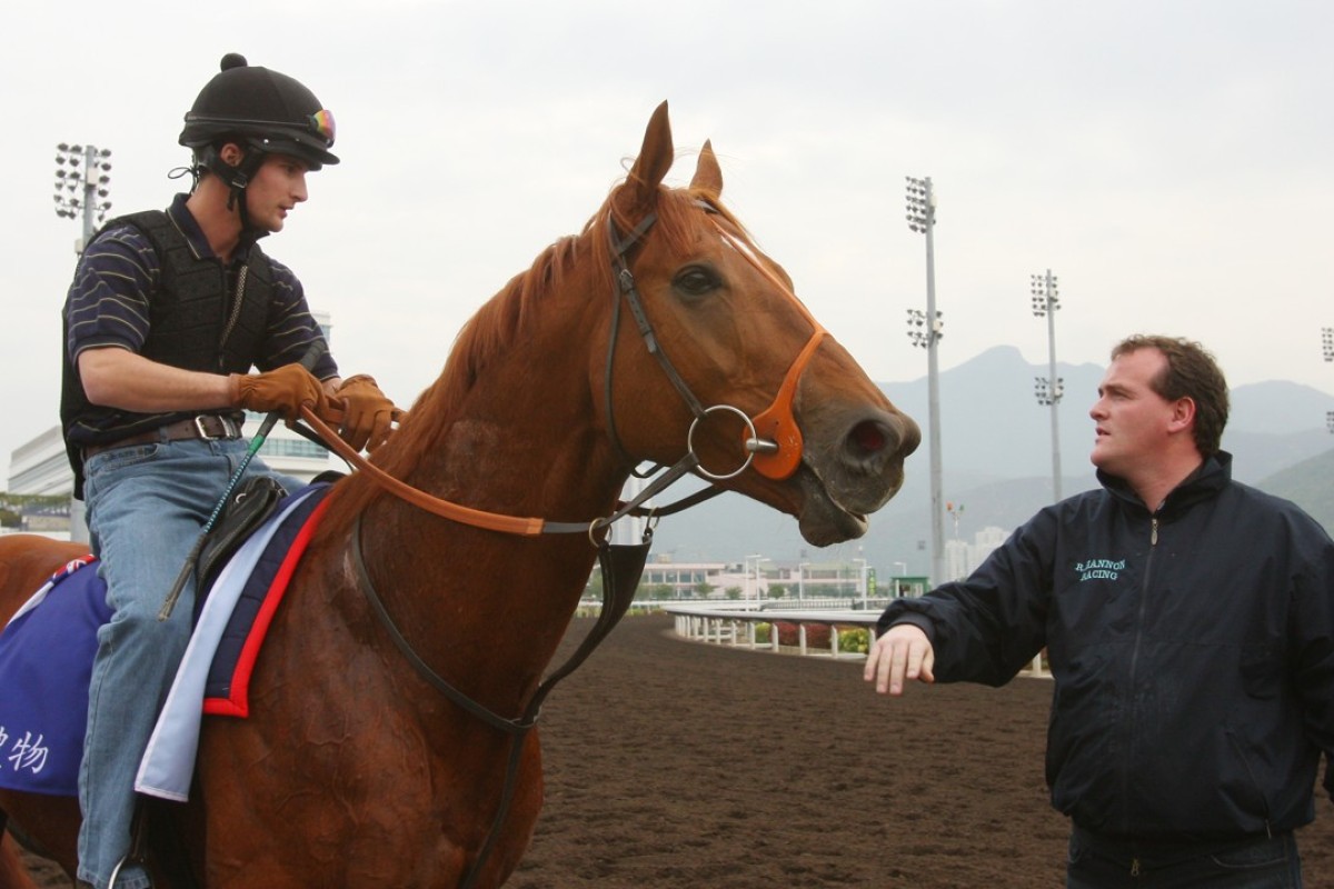 Richard Hannon (right) looks over one of his horses. Photo: Kenneth Chan