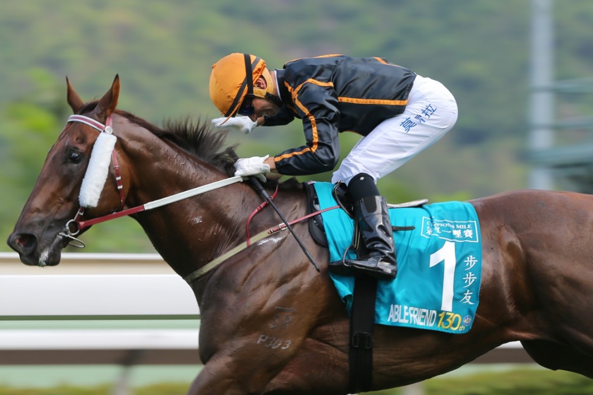 Joao Moreira pats Able Friend after winning the 2015 Champions Mile. Photo: Kenneth Chan