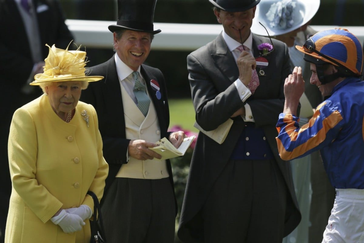 Britain’s Queen Elizabeth II speaks with jockey Ryan Moore (right) and racing manager John Warren (1second left— after arriving in the parade ring on the second day of the Royal Ascot meeting. Photo: AP Photo/Tim Ireland