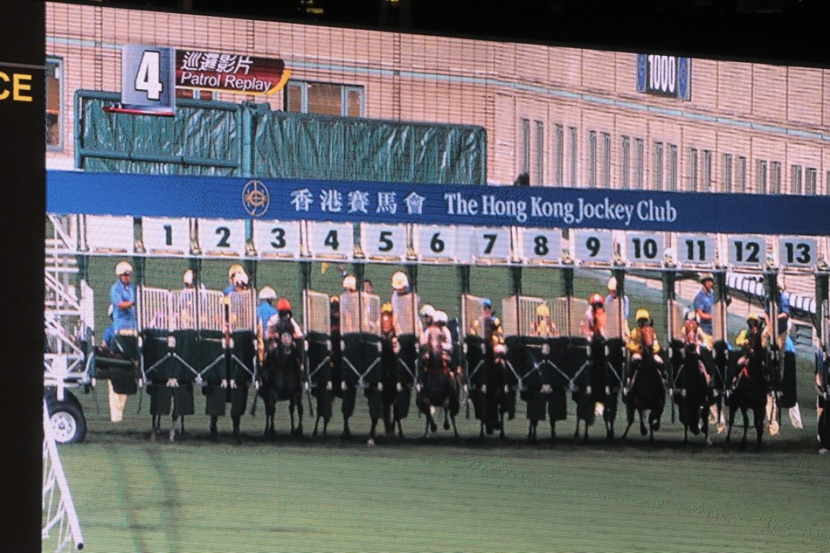 A stray rake causes the barriers at Happy Valley to malfunction. Photos: Kenneth Chan
