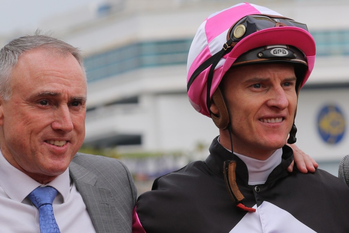 Paul O'Sullivan with Zac Purton after Win Beauty Win takes the Griffin Trophy. Photo: Kenneth Chan