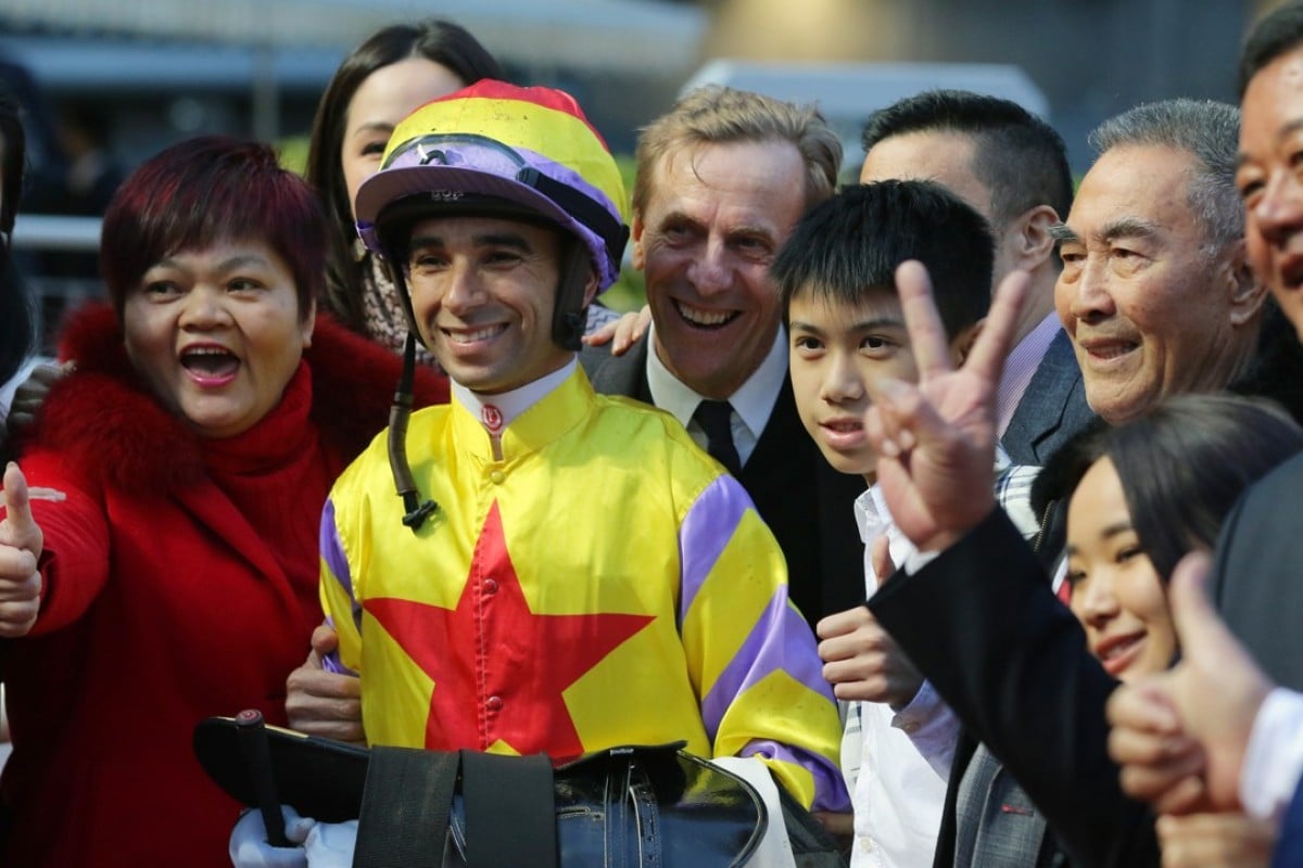 Joao Moreira and John Size smile for photos with the connections of Ping Hai Star. Photos: Kenneth Chan
