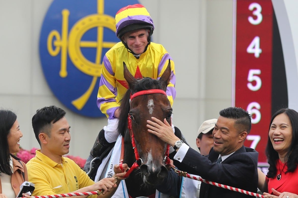 Ping Hai Star gets a pat from connections after winning the BMW Hong Kong Derby. Photos: Kenneth Chan