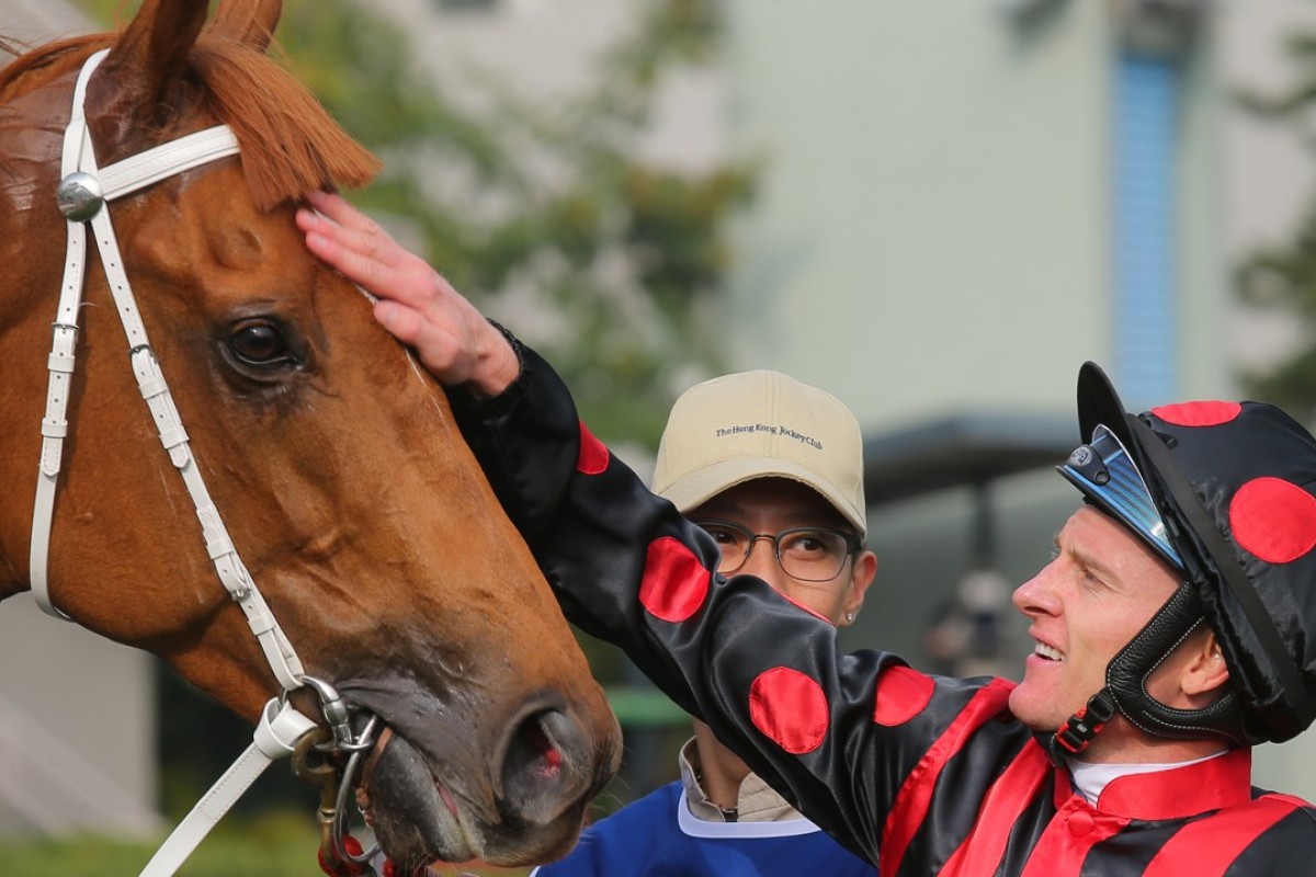 Zac Purton gives Time Warp a pat after their victory in the Citi Hong Kong Gold Cup at Sha Tin on February 18. Photos: Kenneth Chan