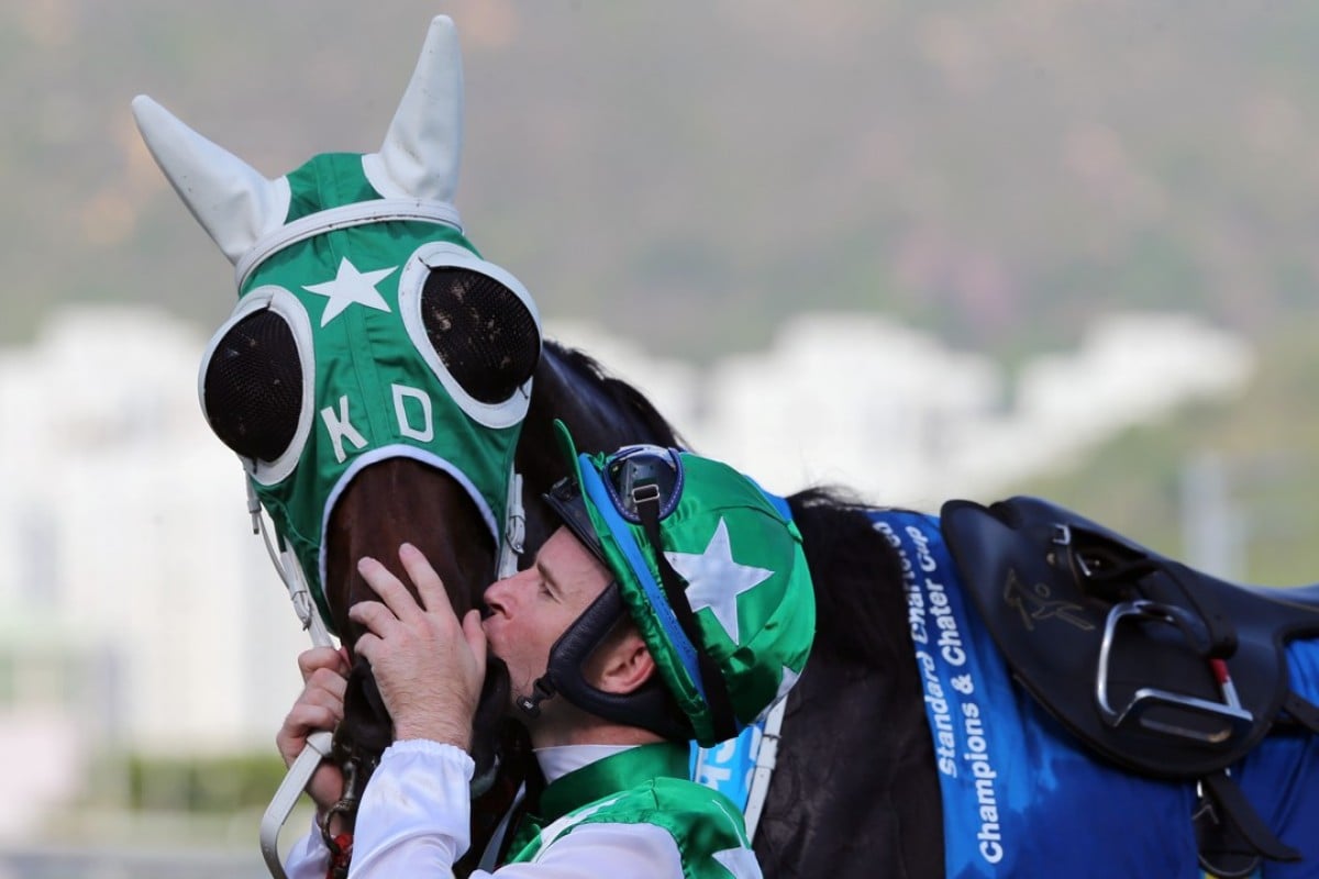 Tommy Berry kisses Pakistan Star after winning the Group One Champions & Chater Cup. Photos: Kenneth Chan