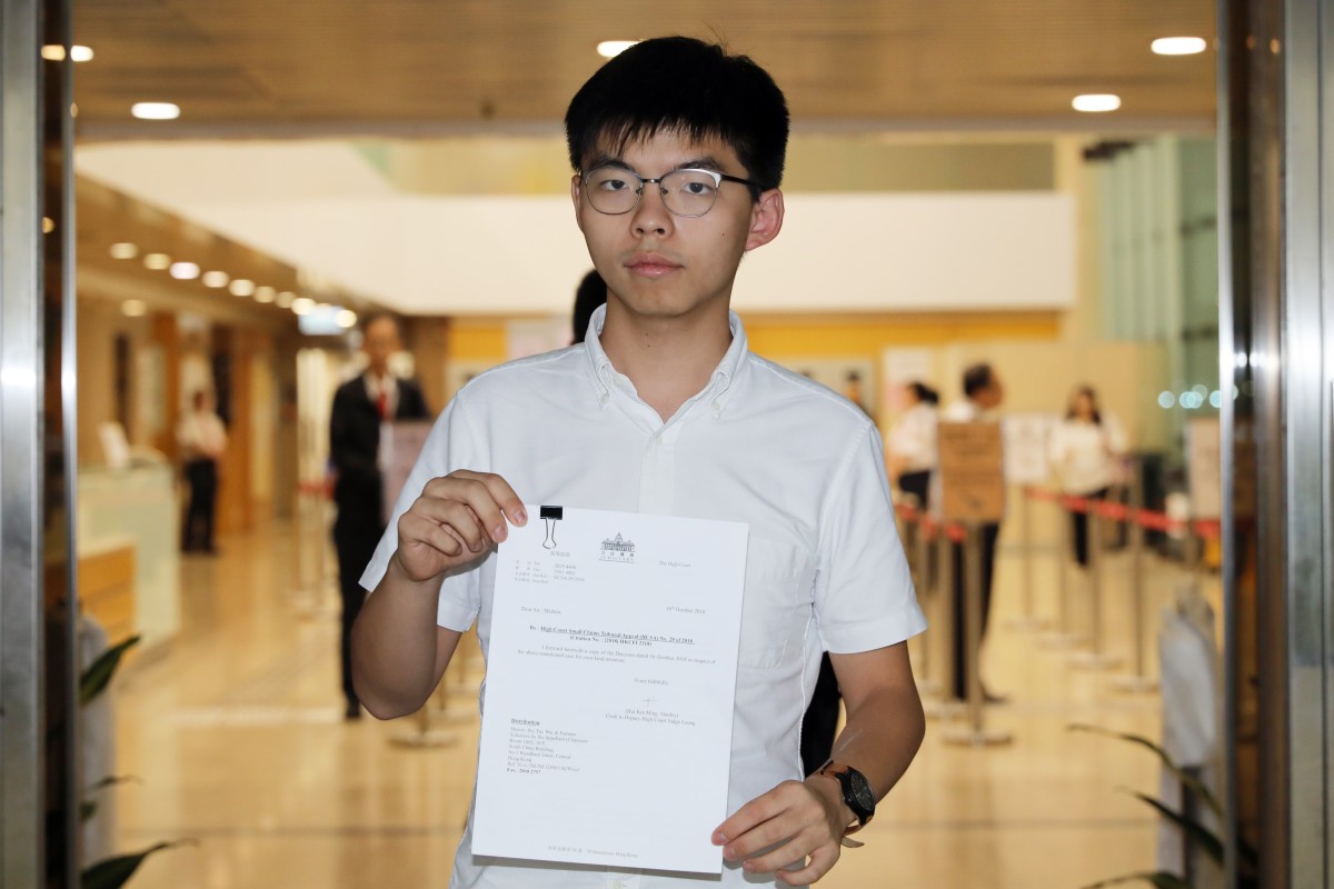 Joshua Wong with the written judgment. Photo: Sam Tsang